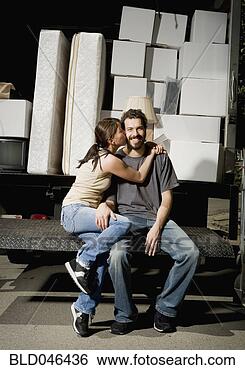 Stock Photo - ethnic-ethnic 
couple hugging 
on moving truck. 
fotosearch - search 
stock photos, 
pictures, images, 
and photo clipart