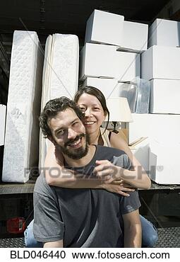 Stock Photography - ethnic-ethnic 
couple hugging 
on moving truck. 
fotosearch - search 
stock photos, 
pictures, images, 
and photo clipart