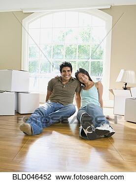 Stock Photo - ethnic-ethnic 
couple in new 
house. fotosearch 
- search stock 
photos, pictures, 
images, and photo 
clipart