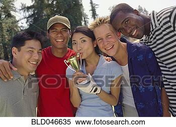 Stock Image - ethnic-ethnic 
friends with trophy. 
fotosearch - search 
stock photos, 
pictures, images, 
and photo clipart