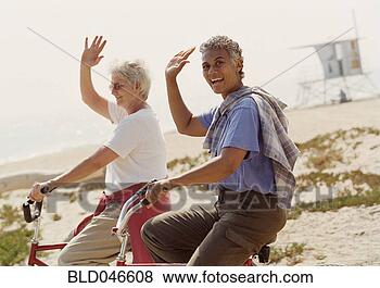 Stock Photo - ethnic-ethnic 
senior women riding 
bicycles. fotosearch 
- search stock 
photos, pictures, 
images, and photo 
clipart