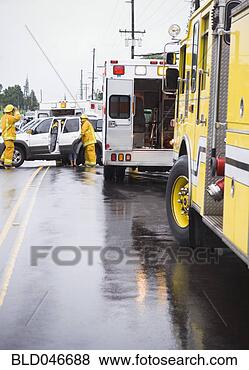 Stock Photo - firefighters at 
accident scene. 
fotosearch - search 
stock photos, 
pictures, images, 
and photo clipart