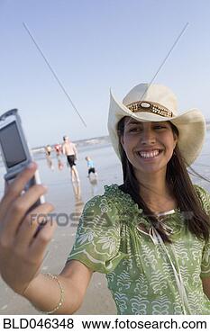Stock Photo - hispanic female 
teenager talking 
own photograph. 
fotosearch - search 
stock photos, 
pictures, images, 
and photo clipart