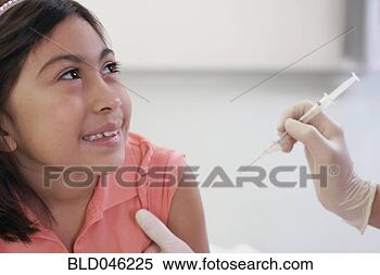 Stock Image - hispanic girl 
receiving shot. 
fotosearch - search 
stock photos, 
pictures, images, 
and photo clipart