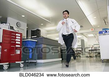 Stock Photo - hispanic male 
doctor running 
in hallway. fotosearch 
- search stock 
photos, pictures, 
images, and photo 
clipart
