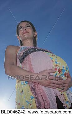 Stock Photo - low angle view 
of pregnant woman. 
fotosearch - search 
stock photos, 
pictures, images, 
and photo clipart