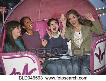 Stock Photo - multi-ethnic girls 
on amusement park 
ride. fotosearch 
- search stock 
photos, pictures, 
images, and photo 
clipart