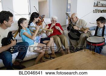Stock Photography - multi-generational 
hispanic family 
playing musical 
instruments. fotosearch 
- search stock 
photos, pictures, 
images, and photo 
clipart