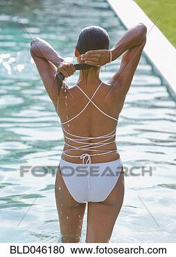 Stock Photography - rear view of woman 
in bathing suit. 
fotosearch - search 
stock photos, 
pictures, images, 
and photo clipart