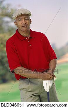 Stock Photography - senior african 
american man with 
golf club. fotosearch 
- search stock 
photos, pictures, 
images, and photo 
clipart