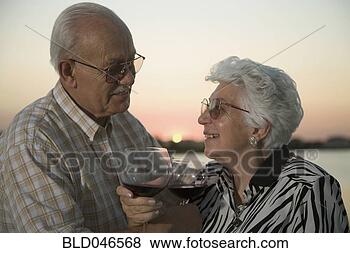 Stock Photo - senior hispanic 
couple drinking 
wine. fotosearch 
- search stock 
photos, pictures, 
images, and photo 
clipart