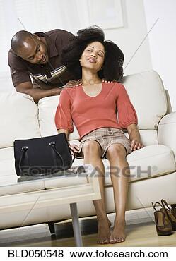 Stock Photo - african american 
man rubbing girlfriend’s 
shoulders. fotosearch 
- search stock 
photos, pictures, 
images, and photo 
clipart