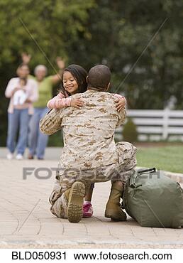 Stock Photography - african american 
military father 
hugging daughter. 
fotosearch - search 
stock photos, 
pictures, images, 
and photo clipart