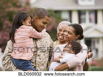 Stock Photo - african american 
military father 
hugging family. 
fotosearch - search 
stock photos, 
pictures, images, 
and photo clipart