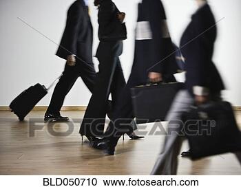 Stock Photography - blurred motion 
shot of multi-ethnic 
businesspeople. 
fotosearch - search 
stock photos, 
pictures, images, 
and photo clipart