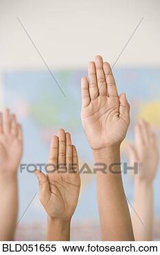 Stock Image - ethnic-ethnic 
children raising 
hands in class. 
fotosearch - search 
stock photos, 
pictures, images, 
and photo clipart