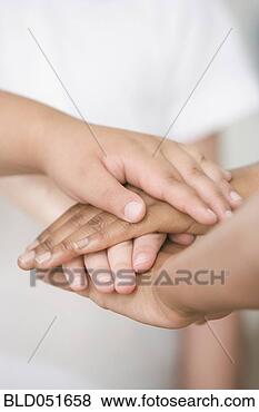 Stock Photo - ethnic-ethnic 
children’s hands 
resting on each 
other. fotosearch 
- search stock 
photos, pictures, 
images, and photo 
clipart