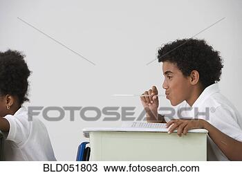 Stock Photo - hispanic boy blowing 
spitball on girl 
in class. fotosearch 
- search stock 
photos, pictures, 
images, and photo 
clipart