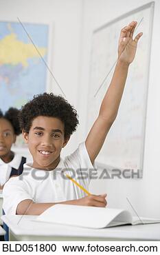 Stock Photography - hispanic boy with 
hand raised in 
class. fotosearch 
- search stock 
photos, pictures, 
images, and photo 
clipart