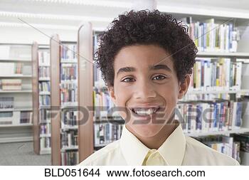 Stock Photo - hispanic boy in 
library. fotosearch 
- search stock 
photos, pictures, 
images, and photo 
clipart