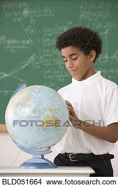Stock Photo - hispanic boy looking 
at classroom globe. 
fotosearch - search 
stock photos, 
pictures, images, 
and photo clipart