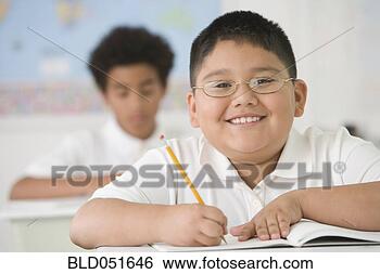 Stock Photo - hispanic boy writing 
at school desk. 
fotosearch - search 
stock photos, 
pictures, images, 
and photo clipart