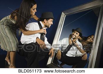 Stock Photo - hispanic woman 
tying husband’s 
tie. fotosearch 
- search stock 
photos, pictures, 
images, and photo 
clipart