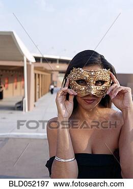 Picture - hispanic woman 
wearing mask. 
fotosearch - search 
stock photos, 
pictures, images, 
and photo clipart