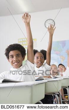 Picture - multi-ethnic children 
raising hands 
in class. fotosearch 
- search stock 
photos, pictures, 
images, and photo 
clipart