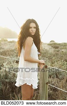 Stock Photo - woman in lingerie 
next to fence. 
fotosearch - search 
stock photos, 
pictures, images, 
and photo clipart