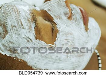 Stock Photograph - african man receiving 
spa facial treatment. 
fotosearch - search 
stock photos, 
pictures, images, 
and photo clipart