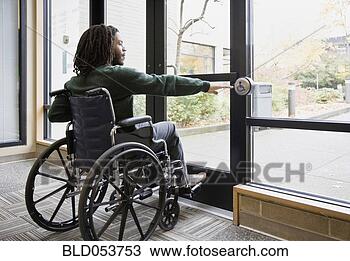 Stock Photo - african man in 
wheelchair using 
automatic door. 
fotosearch - search 
stock photos, 
pictures, images, 
and photo clipart
