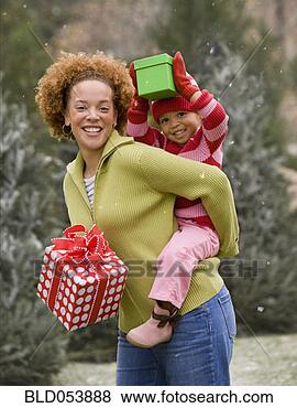 Stock Photo - african mother 
giving daughter 
piggy back ride. 
fotosearch - search 
stock photos, 
pictures, images, 
and photo clipart