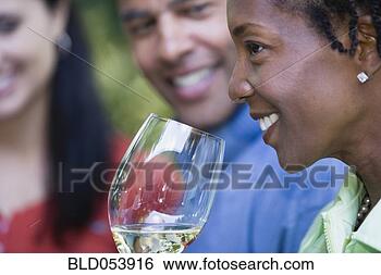 Stock Photo - african woman 
drinking wine. 
fotosearch - search 
stock photos, 
pictures, images, 
and photo clipart