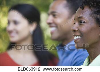 Stock Photo - african woman 
with friends in 
background. fotosearch 
- search stock 
photos, pictures, 
images, and photo 
clipart