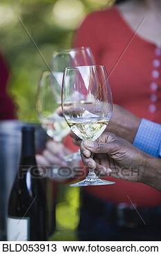 Stock Photo - close of african 
woman holding 
wine glass. fotosearch 
- search stock 
photos, pictures, 
images, and photo 
clipart
