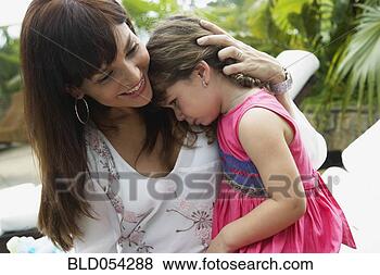 Stock Photo - hispanic mother 
hugging sad daughter. 
fotosearch - search 
stock photos, 
pictures, images, 
and photo clipart
