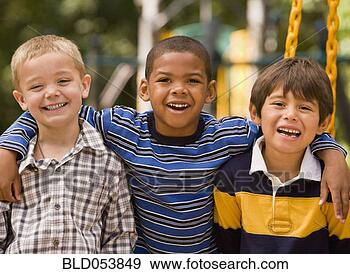 Stock Photograph - multi-ethnic boys 
hugging. fotosearch 
- search stock 
photos, pictures, 
images, and photo 
clipart