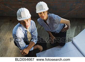 Picture - multi-ethnic businesspeople 
wearing hard hats. 
fotosearch - search 
stock photos, 
pictures, images, 
and photo clipart
