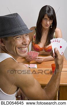 Stock Image - multi-ethnic couple 
playing strip 
poker. fotosearch 
- search stock 
photos, pictures, 
images, and photo 
clipart