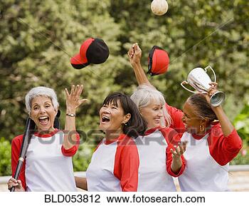 Stock Photo - multi-ethnic senior 
women in baseball 
uniforms cheering. 
fotosearch - search 
stock photos, 
pictures, images, 
and photo clipart