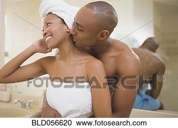 Stock Photography - african couple 
hugging in bathroom. 
fotosearch - search 
stock photos, 
pictures, images, 
and photo clipart