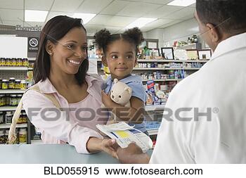 Stock Image - african mother 
and daughter getting 
prescription at 
pharmacy. fotosearch 
- search stock 
photos, pictures, 
images, and photo 
clipart