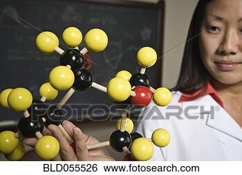 Stock Photo - asian female scientist 
holding molecule 
model. fotosearch 
- search stock 
photos, pictures, 
images, and photo 
clipart