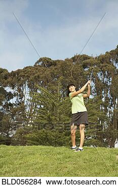 Stock Photo - asian woman playing 
golf. fotosearch 
- search stock 
photos, pictures, 
images, and photo 
clipart