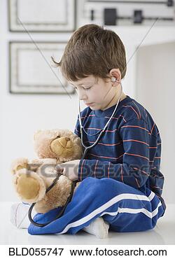 Picture - hispanic boy with 
teddy bear in 
doctor’s office. 
fotosearch - search 
stock photos, 
pictures, images, 
and photo clipart