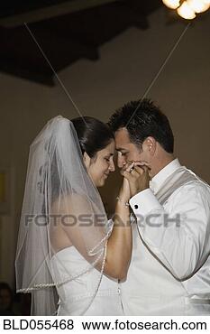 Stock Photo - hispanic bride 
and groom dancing. 
fotosearch - search 
stock photos, 
pictures, images, 
and photo clipart