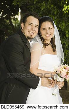 Stock Photograph - hispanic bride 
and groom hugging. 
fotosearch - search 
stock photos, 
pictures, images, 
and photo clipart