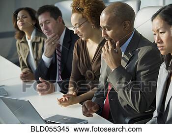 Stock Image - multi-ethnic businesspeople 
at meeting. fotosearch 
- search stock 
photos, pictures, 
images, and photo 
clipart