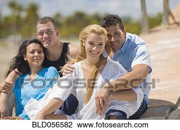 Stock Photo - multi-ethnic couples 
hugging at beach. 
fotosearch - search 
stock photos, 
pictures, images, 
and photo clipart
